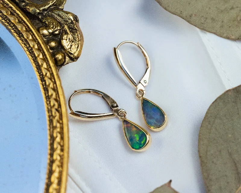 Hoop earrings with rhinestone embellishments for a glamorous and sparkling look-TEARDROP BEZEL SET ETHIOPIAN OPAL EARRINGS IN 14K YELLOW GOLD